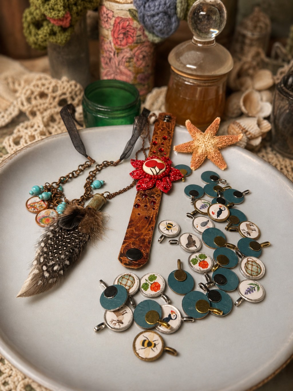 Handmade feather necklace, leather flower bracelet, and illustrated Naturalist Collection charms created by Mary Garcia.